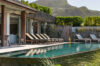 Cozy pool lounge area with a breathtaking view of nature or ocean.