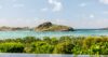 Relaxing pool lounge furnished with loungers, offering panoramic views of the surrounding landscape