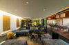 Lounge area inside a beautiful modern villa, featuring stylish furniture and contemporary design elements