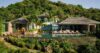 Modern villa surrounded by abundant lush greenery, blending contemporary architecture with natural beauty