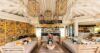 Lounge area inside a beautiful modern villa, featuring stylish furniture and contemporary design elements.
