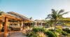 Beautiful luxury villa surrounded by lush natural greenery, blending elegance with serene nature