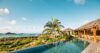 Beautiful scene showcasing an infinity pool seamlessly blending into the surrounding lush nature, creating a tranquil and picturesque view.