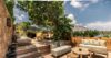 Elegant terrace with outdoor seating, overlooking scenic natural views.