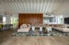 Contemporary villa living room in St Barts with spacious sectional sofa, wood accents, and modern décor.