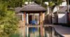 Luxury St Barts villa with pavilion-style lounge facing a serene swimming pool and tropical gardens