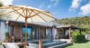 Charming St Barts villa with private plunge pool, hammock, and shaded terrace under blue skies.