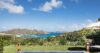 Infinity pool with sweeping ocean and hillside views at a private St Barts villa rental.