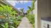 Bright St Barts villa bedroom opening to a terrace with sweeping Caribbean horizon.