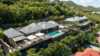 Bright St Barts villa bedroom with king bed, soft natural light, and terrace sea views.