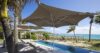 Charming St Barts villa built into a stone windmill with private pool and lush tropical setting.