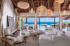 Elegant villa living room in St Barts with natural décor, open sea views, and soft lighting.