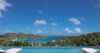 Infinity pool at a luxury St Barts villa with panoramic views of turquoise bays and green hillsides.