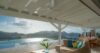 Covered terrace in a St Barts villa with infinity pool, lounge seating, and panoramic views of the Caribbean Sea