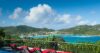 Panoramic ocean view with sun loungers on a terrace overlooking turquoise waters at a hillside St Barts villa rental.