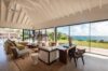 Spacious living room with vaulted ceiling and panoramic ocean views at a luxury St Barts villa.