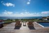 Wooden deck with two sun loungers facing the Caribbean Sea at a luxury St Barts villa rental.