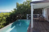 Private plunge pool at a St Barths villa hire with shaded deck and ocean horizon views.
