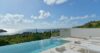Infinity pool with panoramic ocean views and sun loungers at a luxury villa in St Barths.”