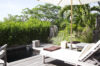 Shaded terrace with sun loungers and tropical greenery beside a plunge pool at a St Barts villa rental