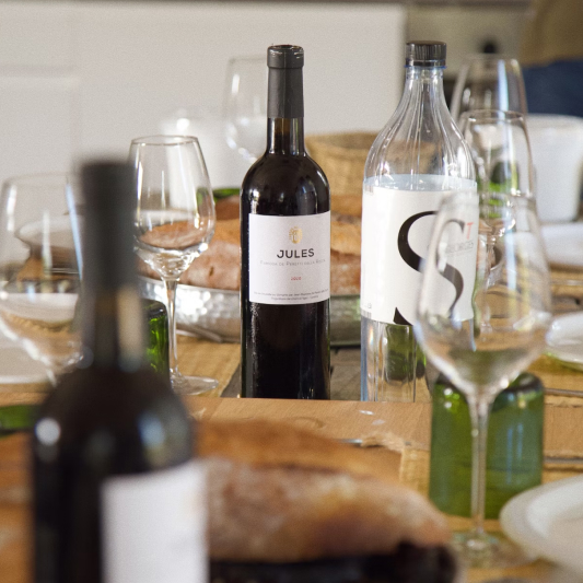 Wine bottle and glasses on dining table