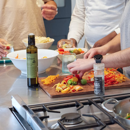 Chef preparing fresh ingredients in kitchen.