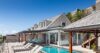 Luxury St Barts villa with private pool, sun loungers, and ocean-view terrace.