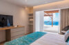 Bedroom with terrace access and ocean views at a luxury St Barts vacation rental villa.