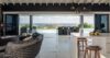 Open-plan living room and kitchen with ocean view terrace at St Barts villa.”