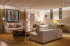 Warmly lit living room with contemporary art and elegant seating at a luxury villa rental in St Barts.