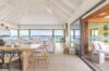 Open-concept living and dining area with ocean views at a luxury St Barths villa rental.