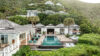 Aerial view of Villa Plumbago with infinity pool nestled in lush hills, Colombier, St Barts villa rentals