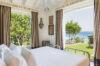 Bedroom with open windows overlooking the sea at Villa Plumbago, Colombier, luxury villas St Barts.