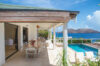 Covered outdoor dining terrace overlooking the pool and ocean at Villa Plumbago, St Barts luxury villa rental