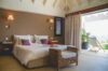 Elegant bedroom with terrace and ocean view at Villa Plumbago, St Barts villa rental.