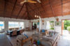 Spacious living room with vaulted wood ceiling and ocean view at Villa Plumbago, Colombier, luxury villas St Barts.