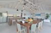Contemporary dining and kitchen area with vaulted ceiling at Villa Plumbago, Colombier, St Barthelemy vacation rentals