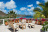 Sunlit terrace with ocean view and potted bougainvillea at Villa Plumbago, Colombier, vacation rentals St Barts.