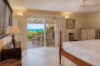 Bedroom opening onto terrace with ocean view at Villa Plumbago, Colombier, St Barthelemy vacation rentals