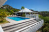 Terraced pool deck surrounded by tropical hills at Villa Plumbago, Colombier, St Barts villa rentals