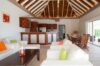 Open-plan living room with vaulted ceiling and kitchen area in a private St Barts villa rental