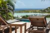 Sun loungers on wooden deck overlooking the turquoise lagoon at Villa Plumbago, st barts villa rental