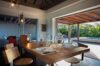 Dining table set for two beside open terrace with pool view at Villa Plumbago, st barts villa rental