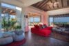 Contemporary living room in st barts villa with red sofa, open layout, and panoramic ocean views
