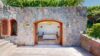 Stone-clad guest suite of private villa rentals in st barts with open-air terrace and minimalist design