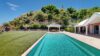 Luxury st barts villa with long turquoise pool, garden lawn, and shaded dining gazebo