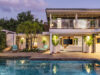 Luxury st barts villa with pool, tropical garden, and open-plan living at sunset