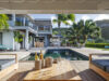 Private villa rentals st barts with poolside lounge, champagne setup, and tropical views.