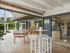 Open-air dining terrace and modern kitchen at luxury villa st barths near the pool.