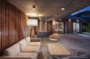 Evening terrace lounge with wooden walls and soft lighting at st barths villa